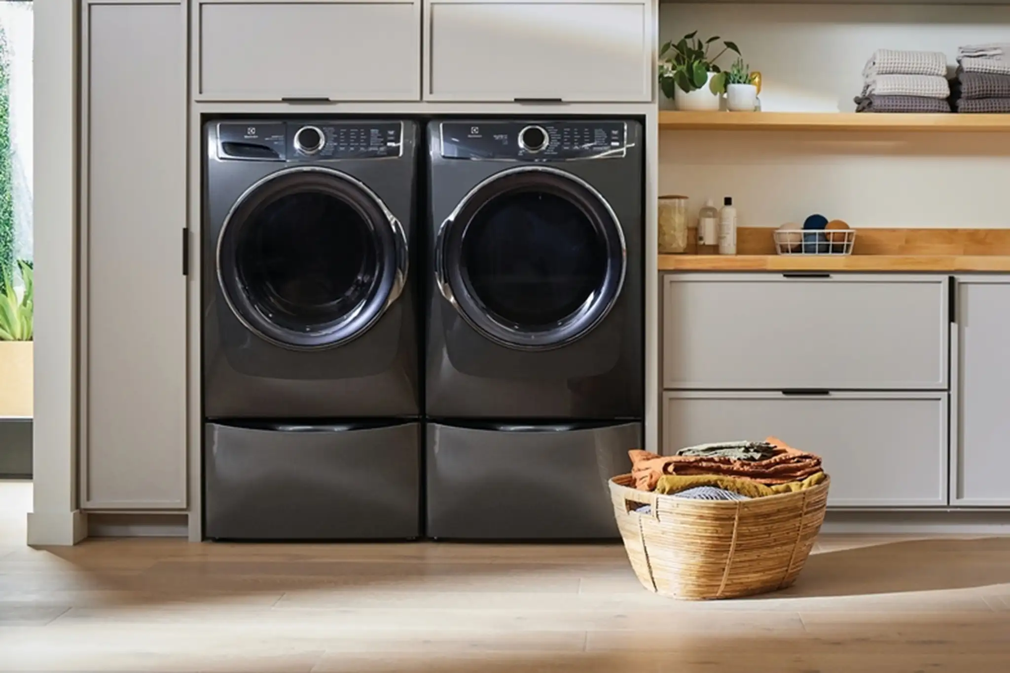 Dryer vent cleaning near you: front-loading washer and dryer in a home laundry room